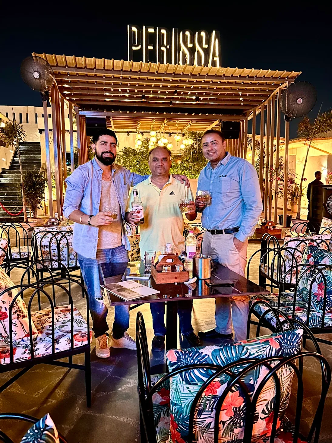 Friends posing with party props